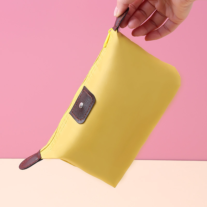 Korean version large capacity dumpling cosmetic bag handbag foldable travel wash storage bag candy colored dumpling bag Application Scenario