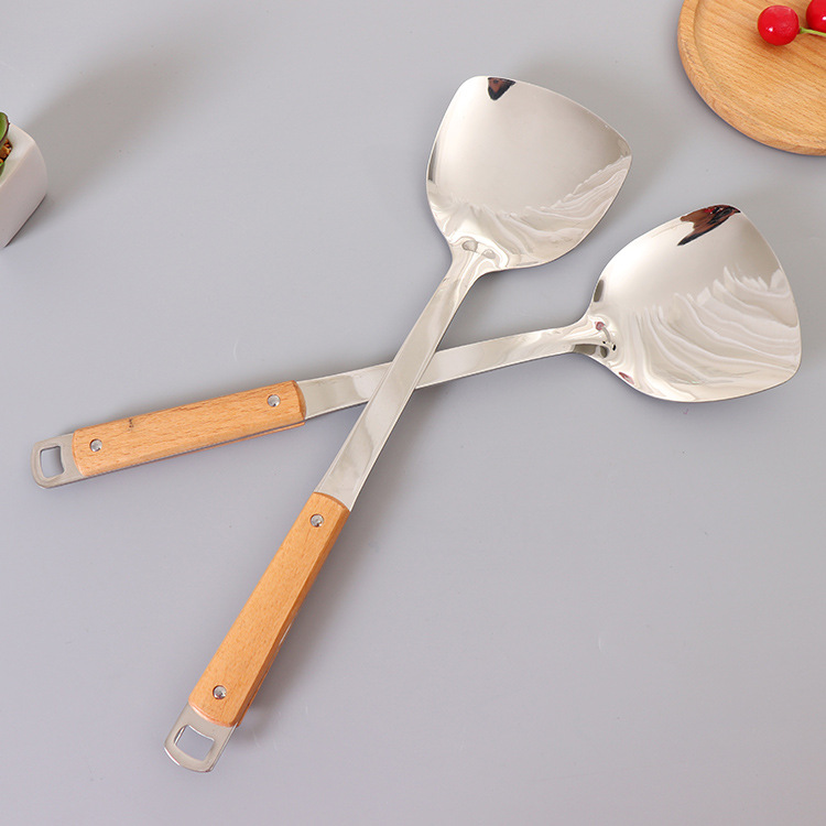 Non-magnetic stainless steel 3 cm thick wooden handle spatula high quality household stainless steel cooking spoon spatula details Picture