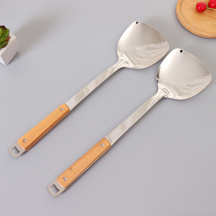 Non-magnetic stainless steel 3 cm thick wooden handle spatula high quality household stainless steel cooking spoon spatula Application Scenario