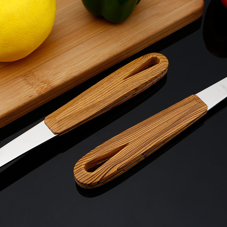 Stainless steel 3 cm thick wood grain grip handle cooking spatula colander two pieces Application Scenario