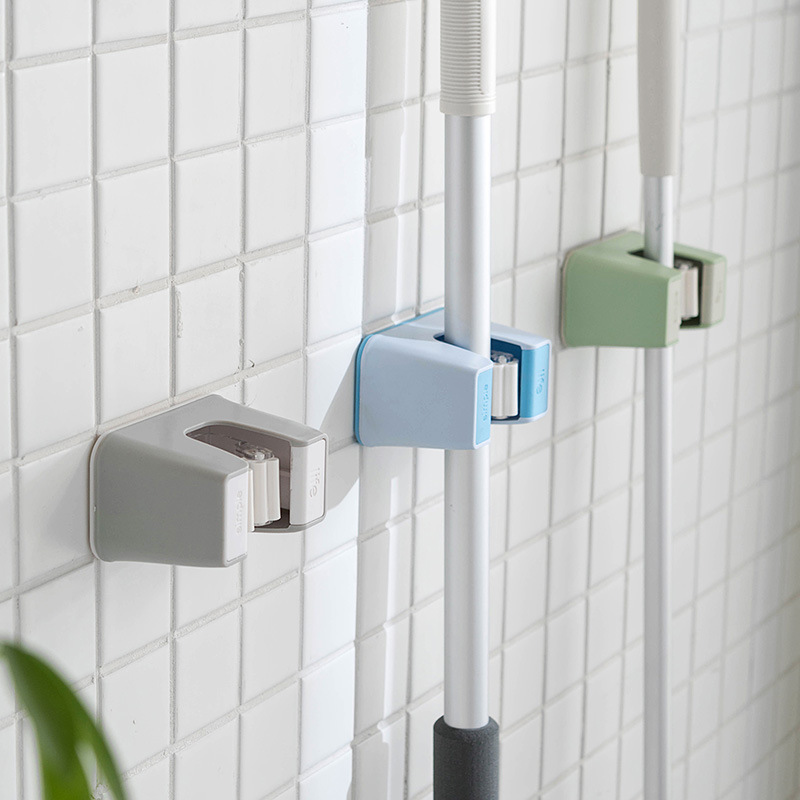 Large bathroom mop rack no hole no trace hook wall-mounted sticky hook clip rack booth mop storage rack Application Scenario